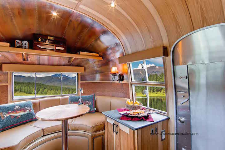 1950s Airstream Trailer Restored as Modern Mobile Home with Cozy Wood