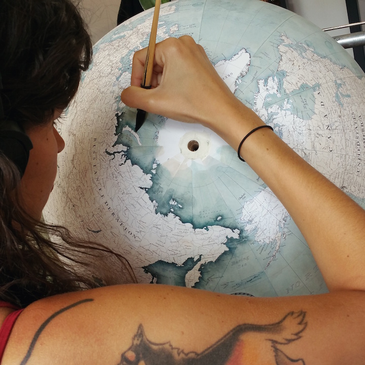 Woman Hand-Crafting a Globe at Bellerby & Co. Globemakers