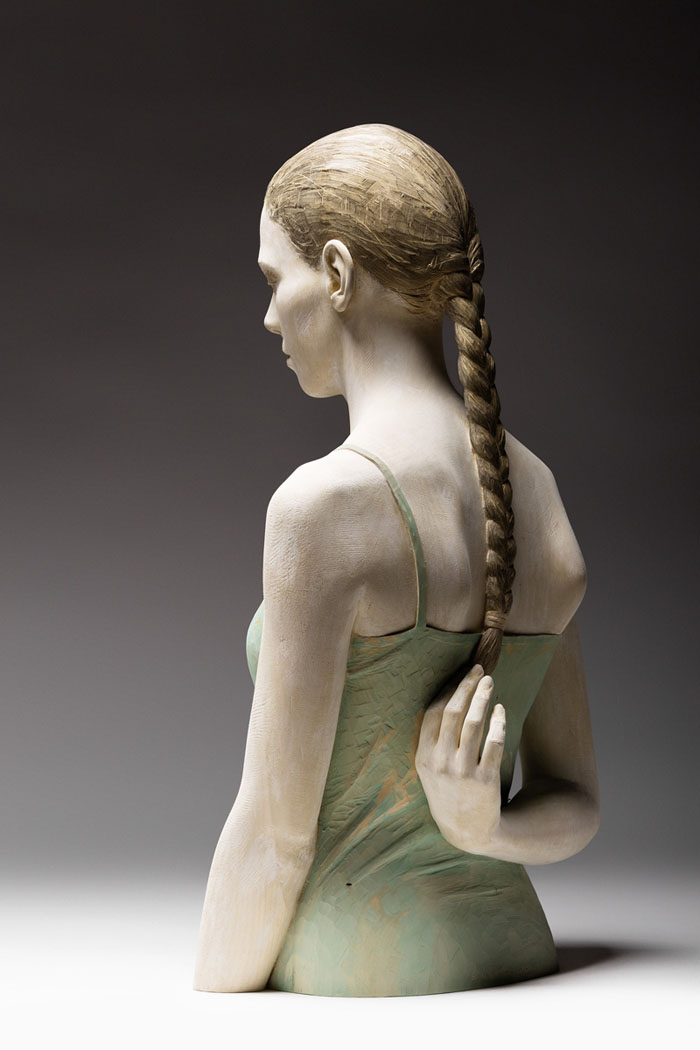 Lifelike Wood Sculptures Of Pensive Men And Women