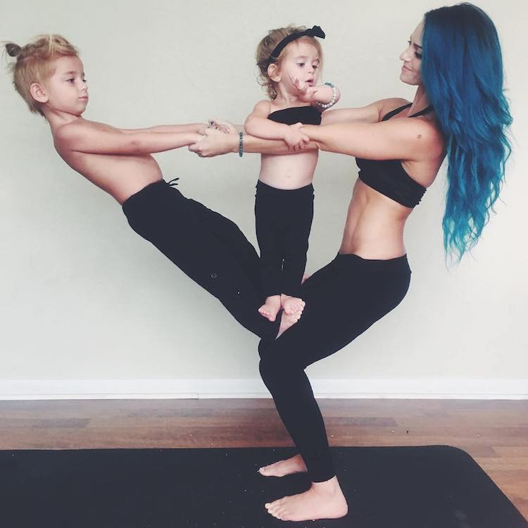 Mom Practice Family Yoga with the Help of Her Two Kids
