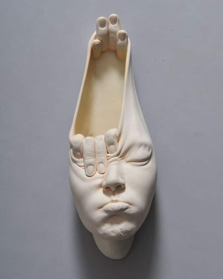 Open Mind surreal face sculpture by Johnson Tsang