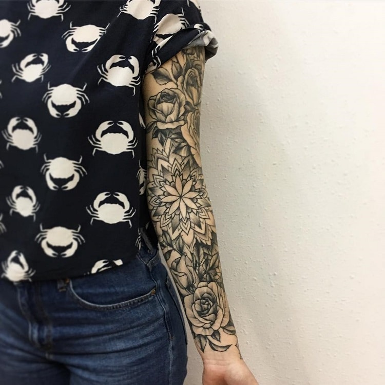 Bold Flower Tattoos Gracefully Drape Across the Body