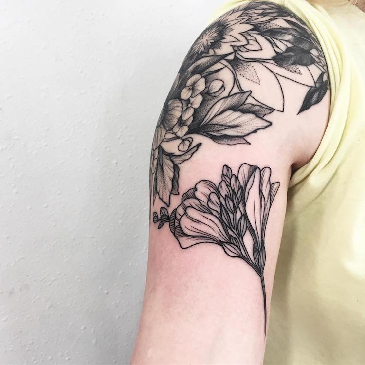 Bold Flower Tattoos Gracefully Drape Across the Body