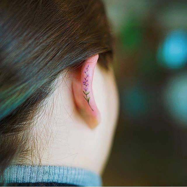 Floral Earring Tattoo on ear lobe  Tiny flower tattoos Tattoos for women  half sleeve Ear lobe tattoo