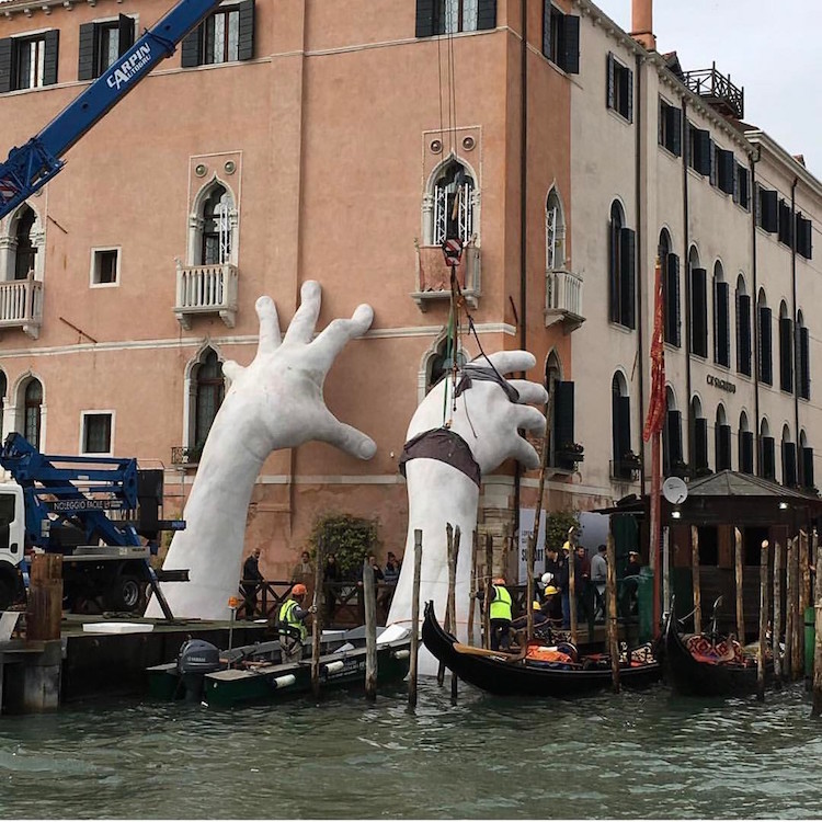 Contemporary Sculpture by Lorenzo Quinn Emerges from Venice's Lagoon