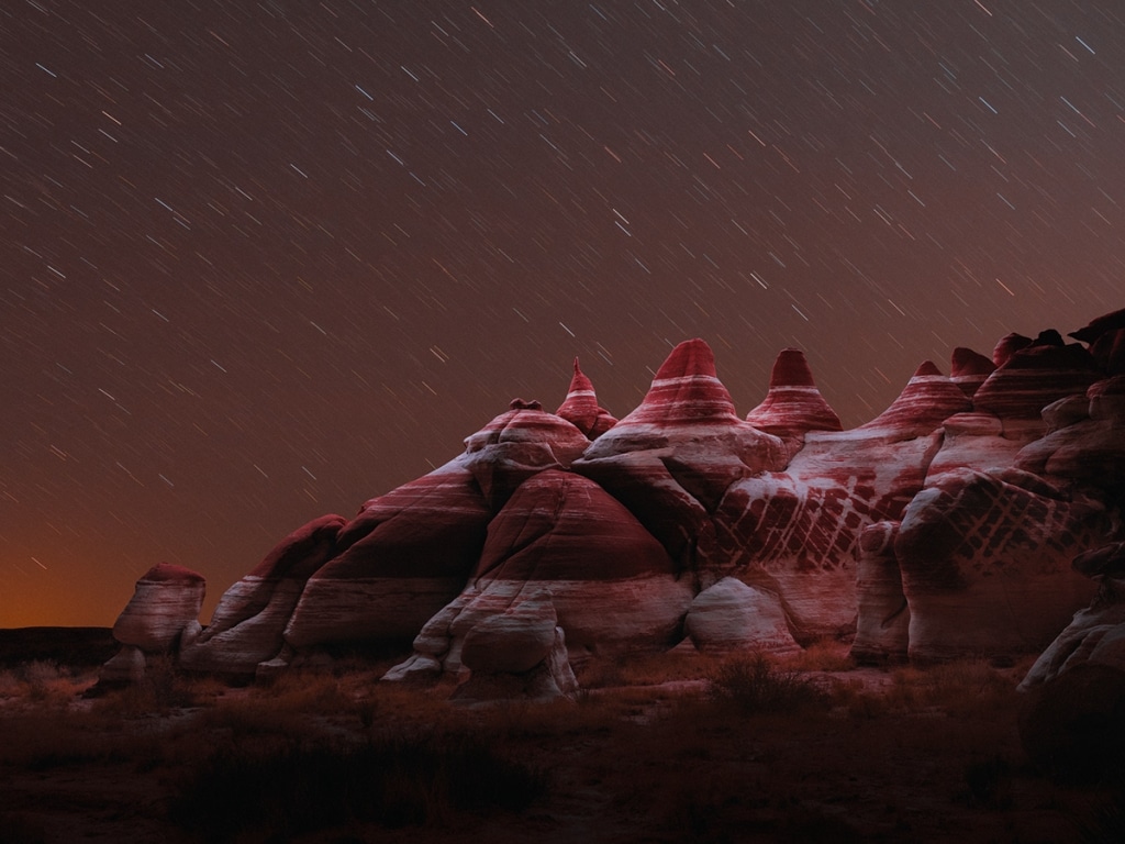 Long Exposure Drone Photographs Create Light Halos Over Mountains Long exposure drone photographs create light halos over mountains