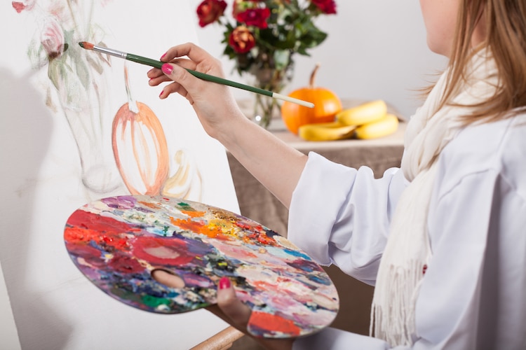 Person Painting on a Canvas