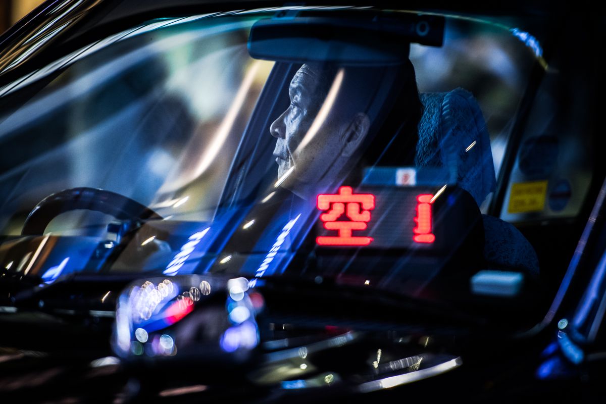 Photo of Taxi Driver in Tokyo by Oleg Tolstoy