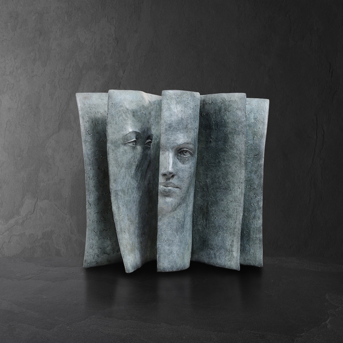 Face Emerging from Book by Sculptor Paola Grizi