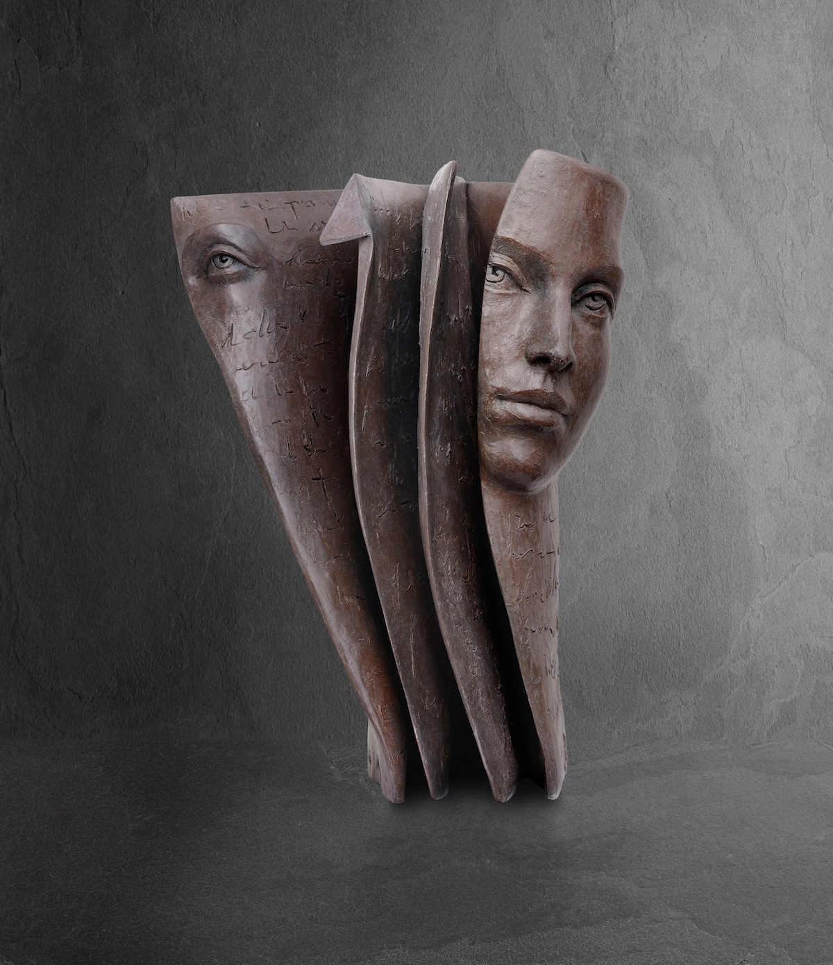 Face Emerging from Book by Sculptor Paola Grizi