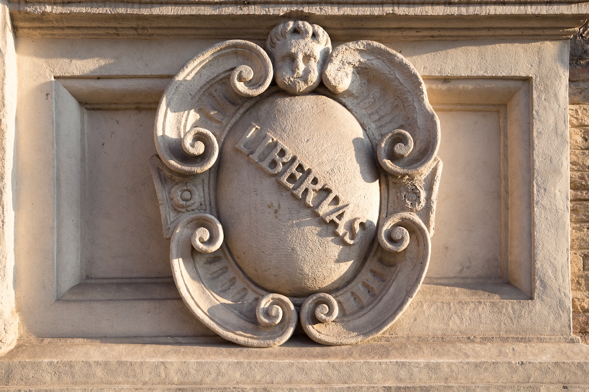 Vintage ornament of Libertas the Roman goddess on a historic building