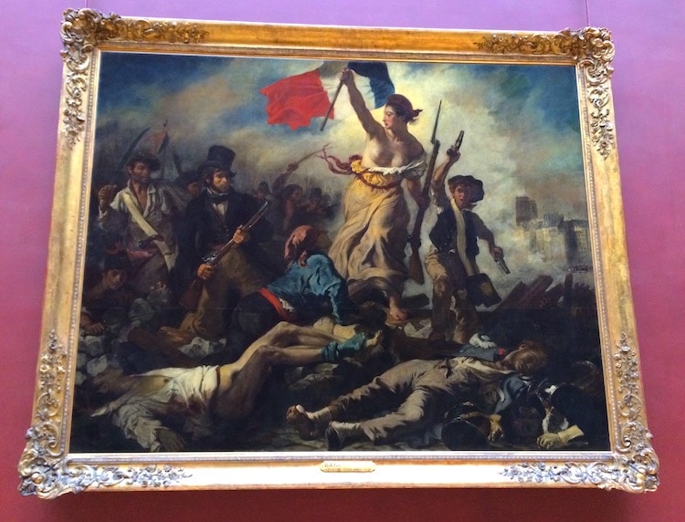 History: This picture shows a person holding the France flag in the French  Revolution. That shows t…