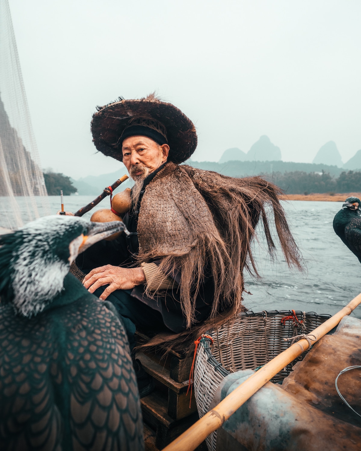 Cormorant fishing by Peter Yan Travel Photography