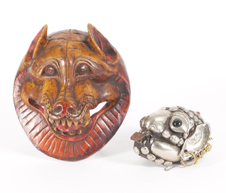 Nepalese Carved and Lacquered Wood Mask and a Tibetan Silver Decorated Animal Skull 