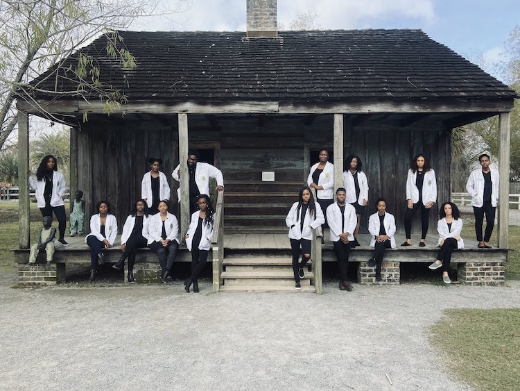 Black Medical Students Pose in Front of Plantation
