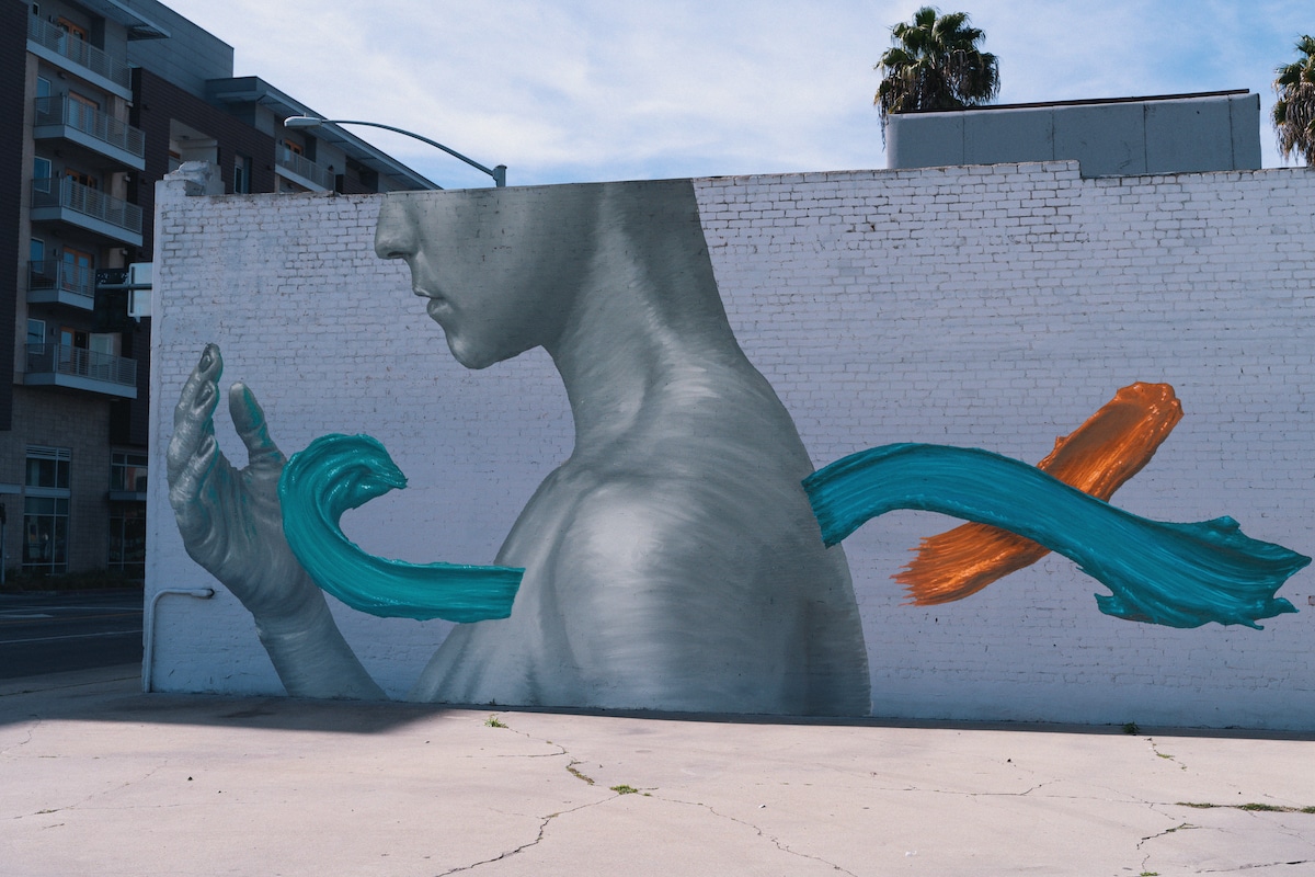 Mural of Monochrome Torso with Colorful Paint Strokes