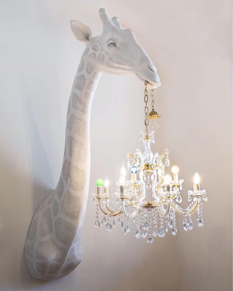 Giraffe Sculpture Holds A Chandelier, Giraffe Chandelier Wall Lamp