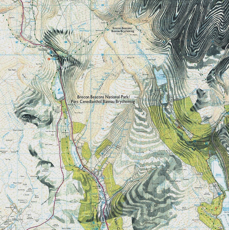 Map Art Sees Faces Emerge From Topographic Contours and Patterns