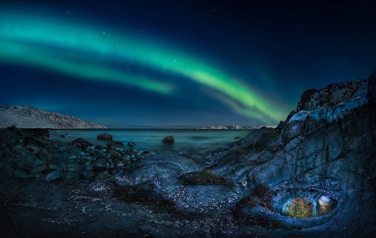 Northern Lights Above Rocky Surface