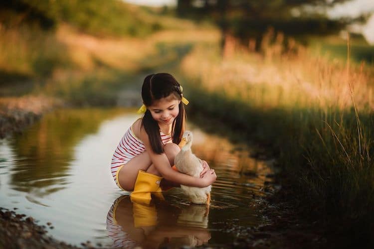 Adorable Children With Baby Animal Photos Showcase Sweet Bonds