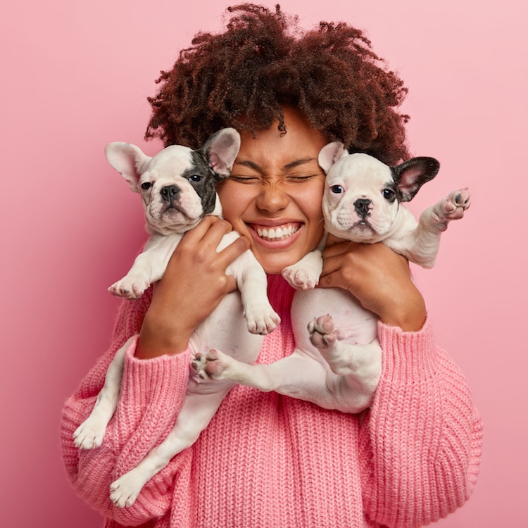 Woman of Color Holding Dog