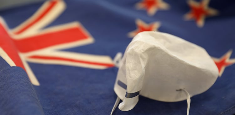 Discarded Coronavirus Mask On New Zealand Flag