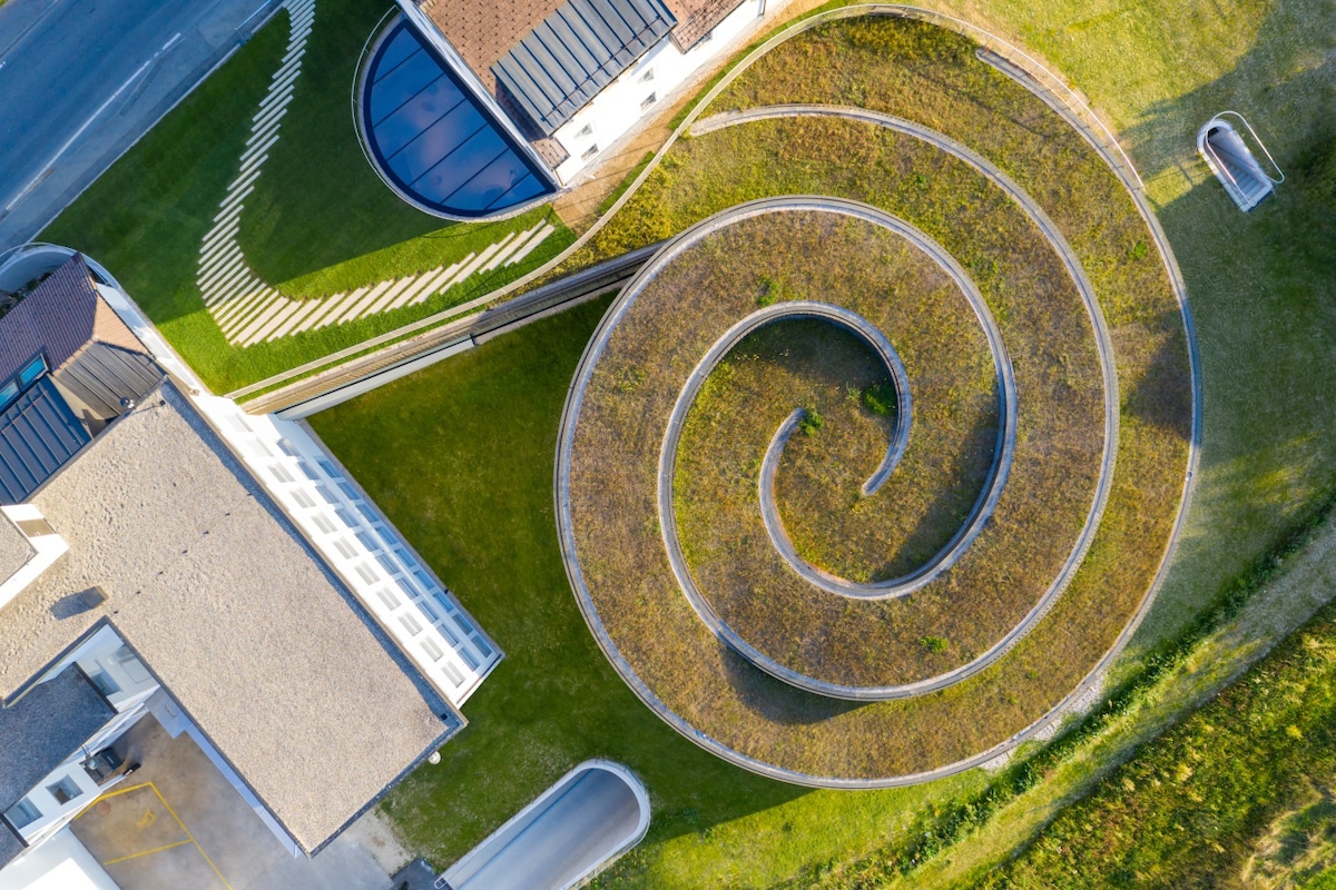 Aerial View of Grass Roof at the Musée Atelier Audemars Piguet by Bjarke Ingels Group