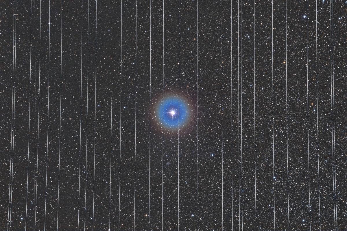 Albireo double star Surrounded by Trails of Moving Satellites