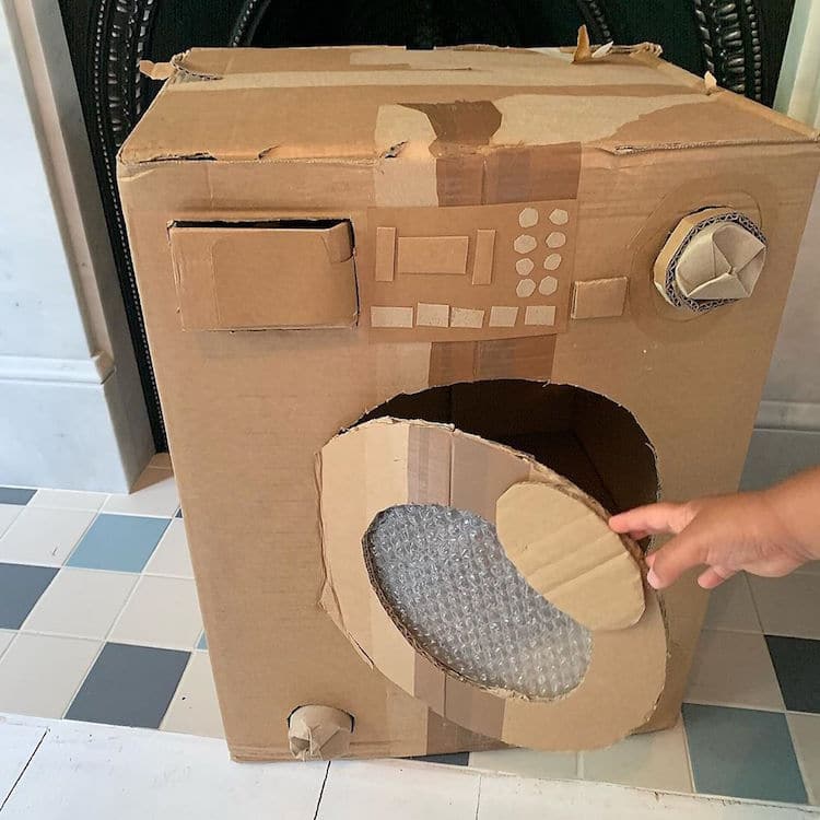 Cardboard artist Sydney Piercey washing machine
