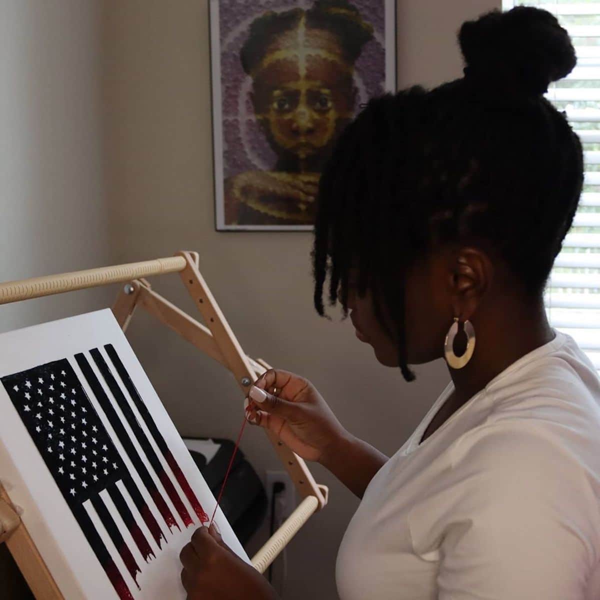 Nneka Jones embroiders the American flag