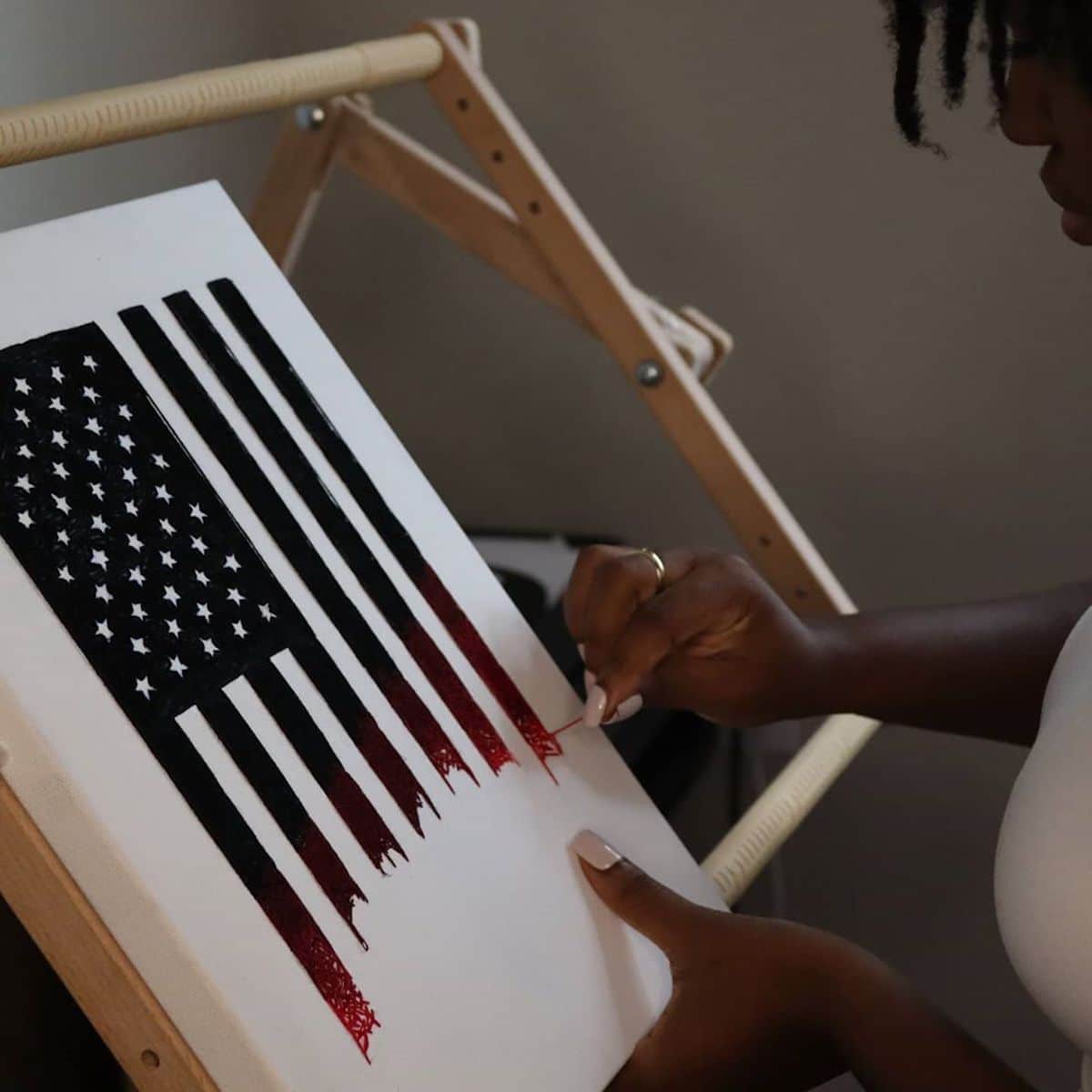 Nneka Jones embroiders the American flag