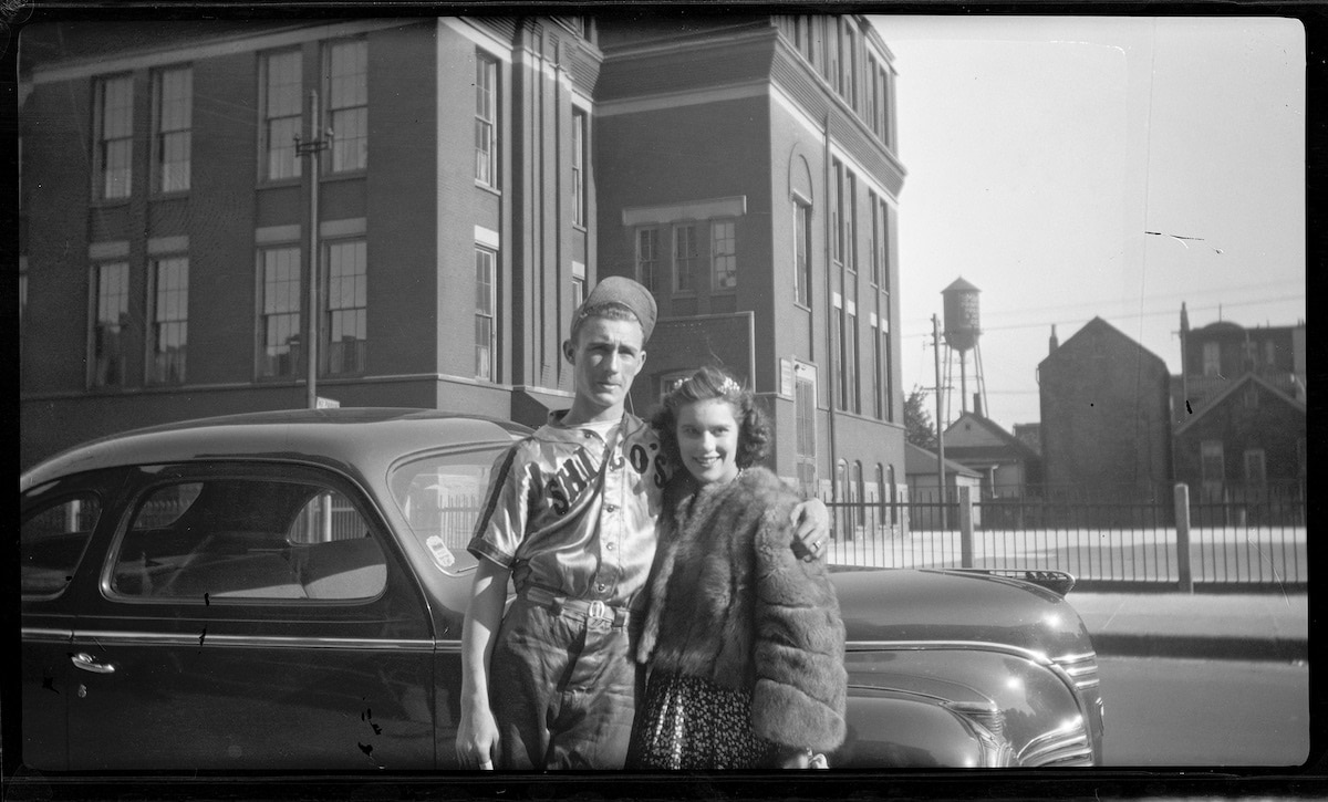 Old Photo of a Couple Posing in Front of a Car in Chicago