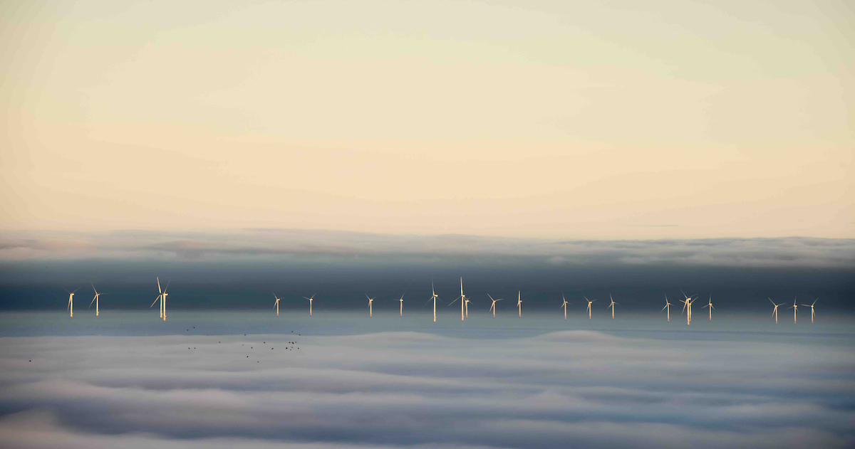 Wind Turbines Emerging from Fog