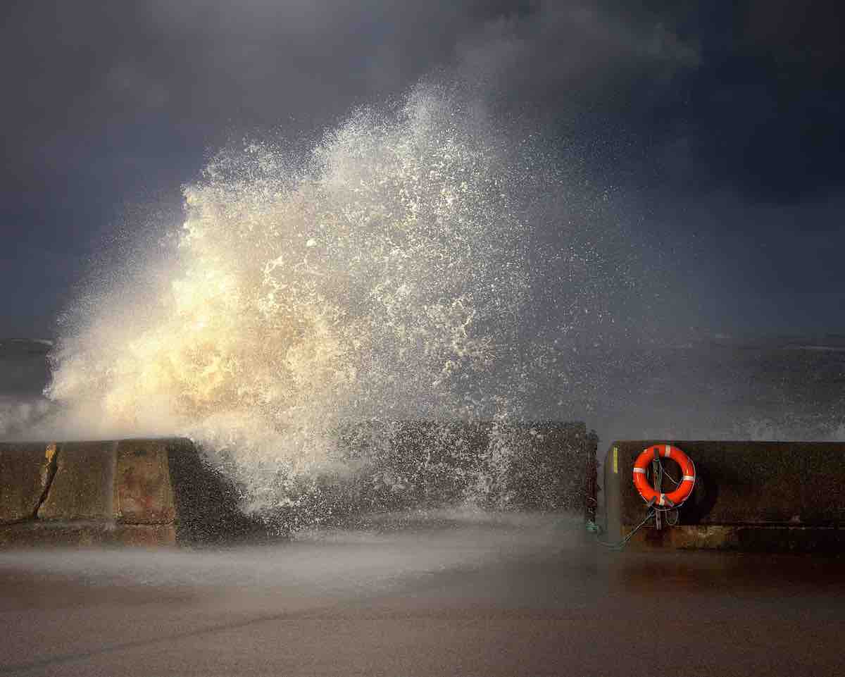 Waves Crashing Into Cement Barriers