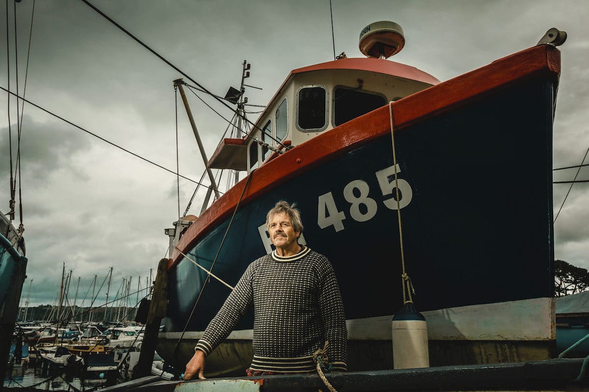 Captain Posting in Front of His Rescue Boat