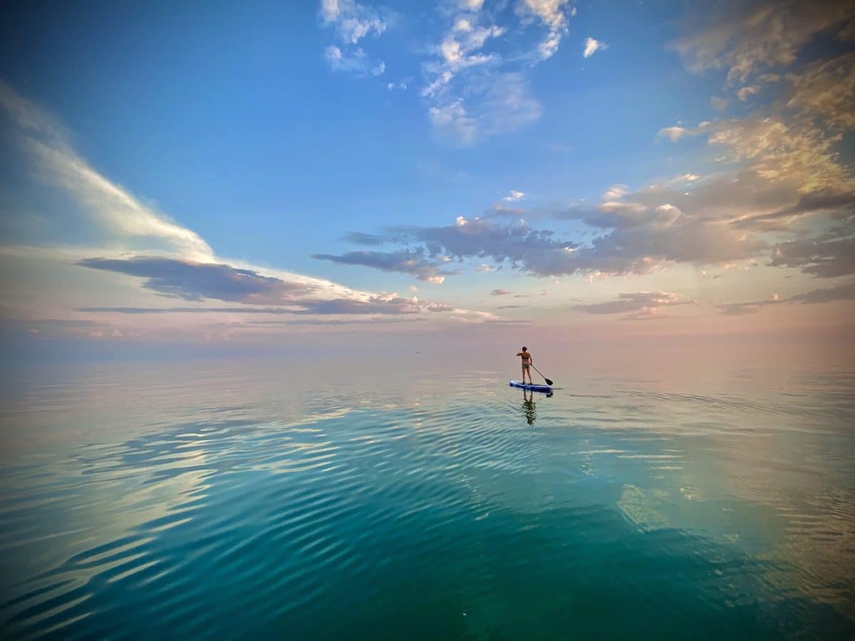 Paddle Boarder on Calm Waters