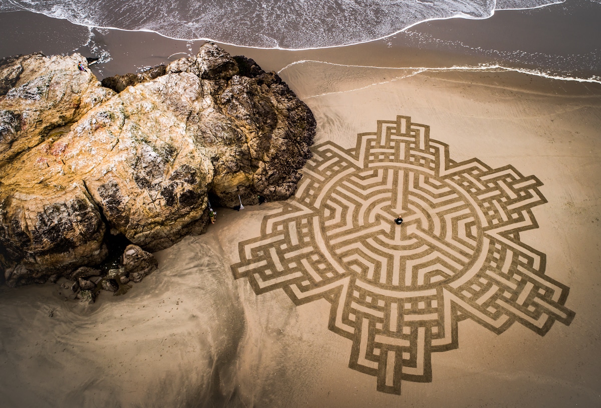 Artist Walks Along Shores To Create Massive Sand Designs Before High ...