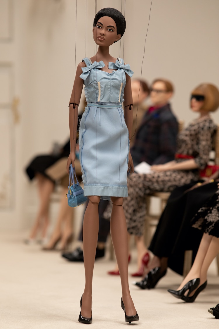 Puppet Wearing Moschino Dress