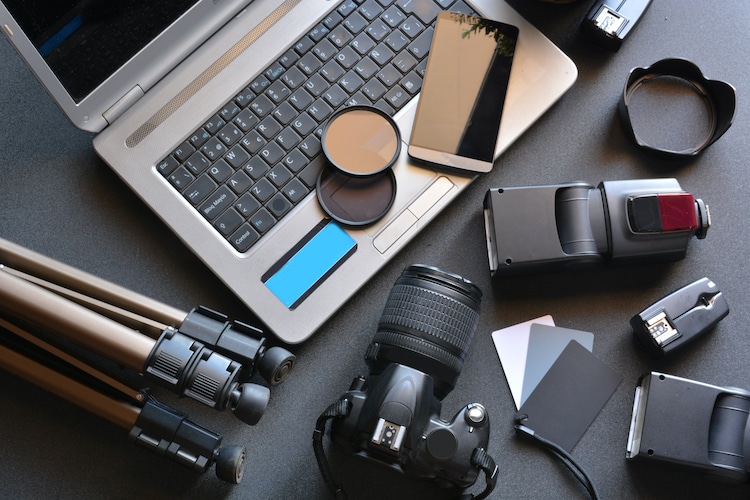 Camera, Photography Supplies, and a Computer