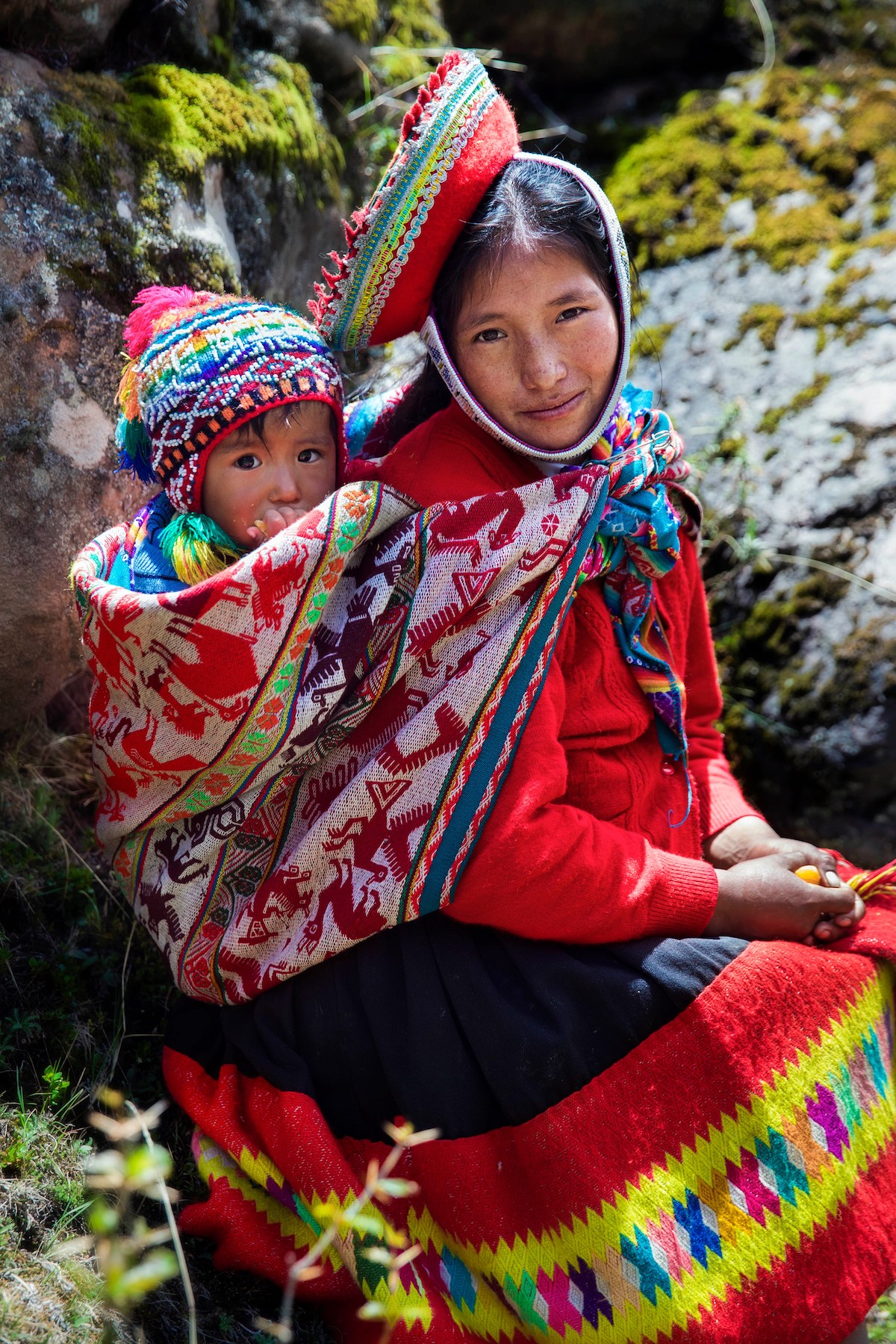 Woman and her son in the Andes Mountains