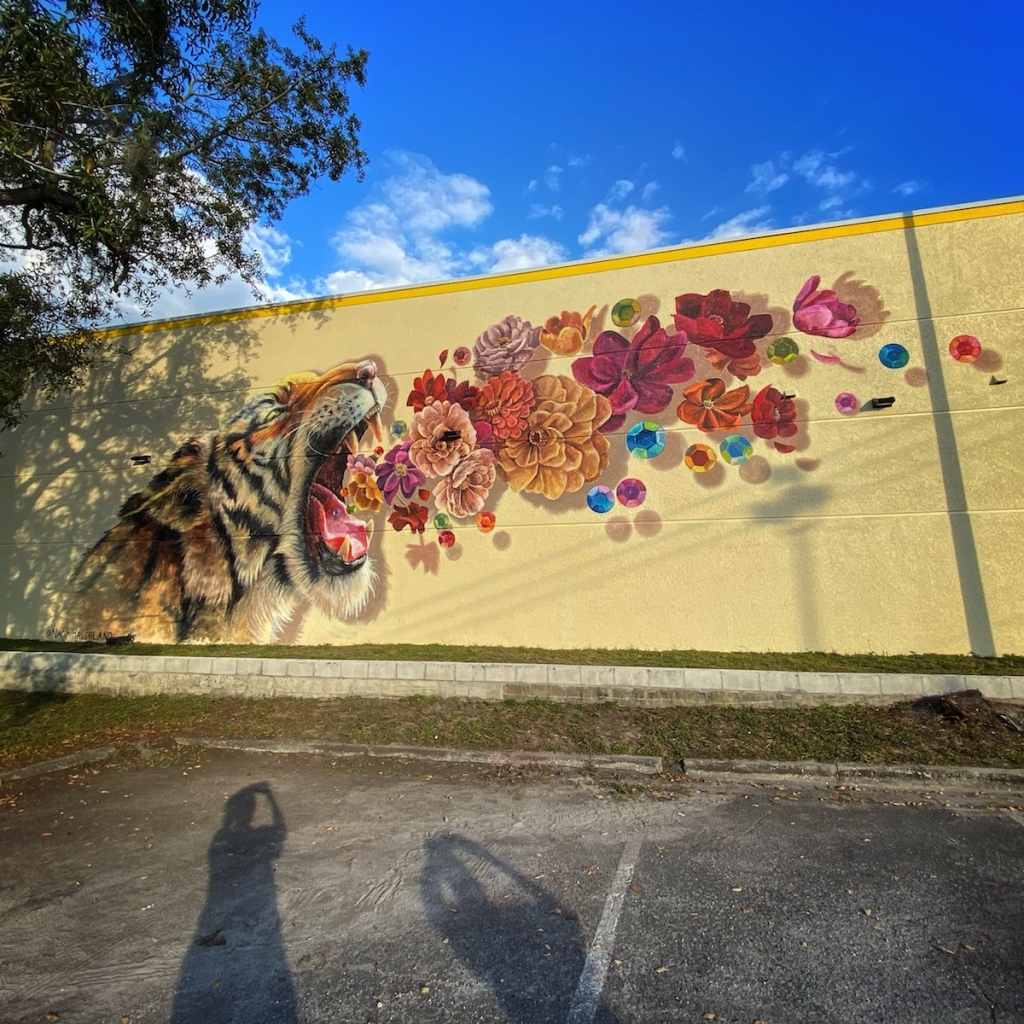 Colorful Tiger Mural Roars A Bouquet Of Flowers And Sequins