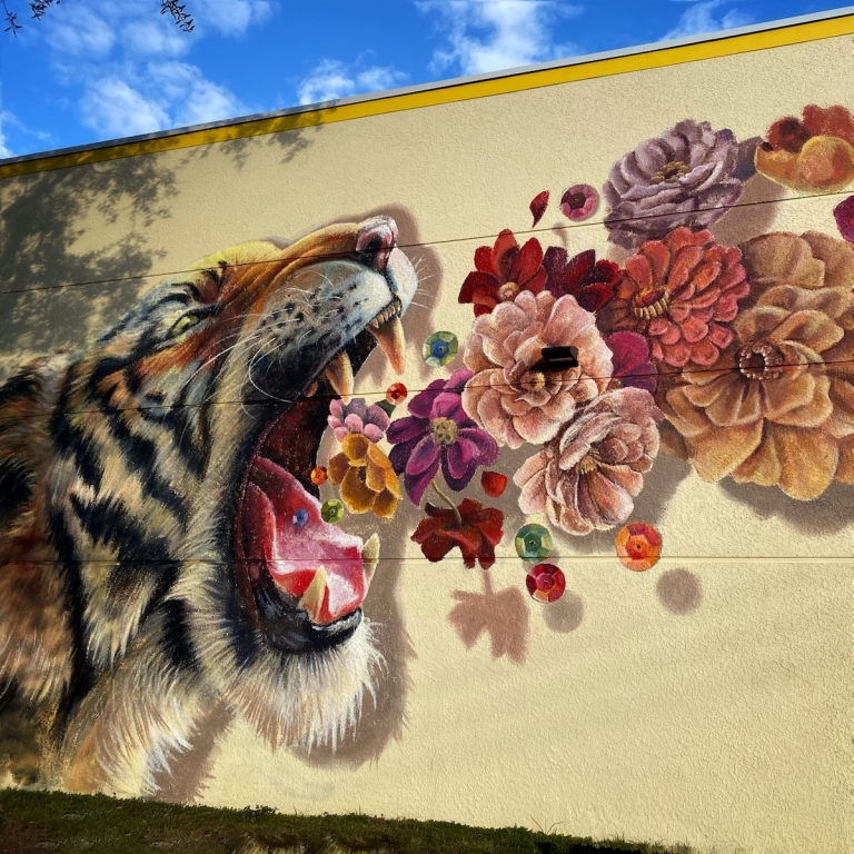 Colorful Tiger Mural Roars A Bouquet Of Flowers And Sequins