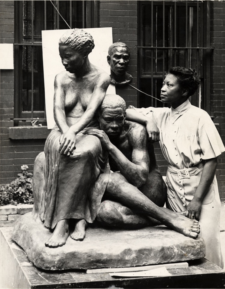 Augusta Savage Posing with Sculpture