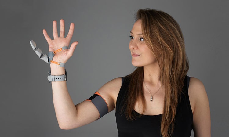 Designer Dani Clode with her "third thumb" device. 