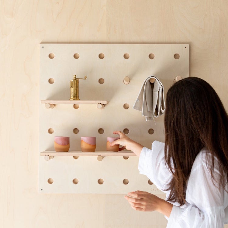 Woman Decorating a Peg Board