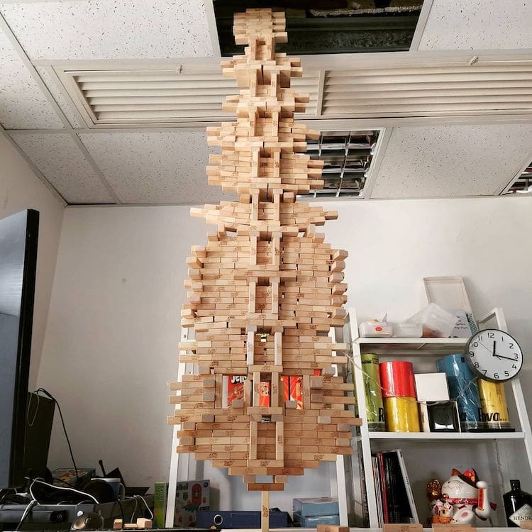 Guy Breaks His Own World Record for Balancing 1,512 Jenga on One