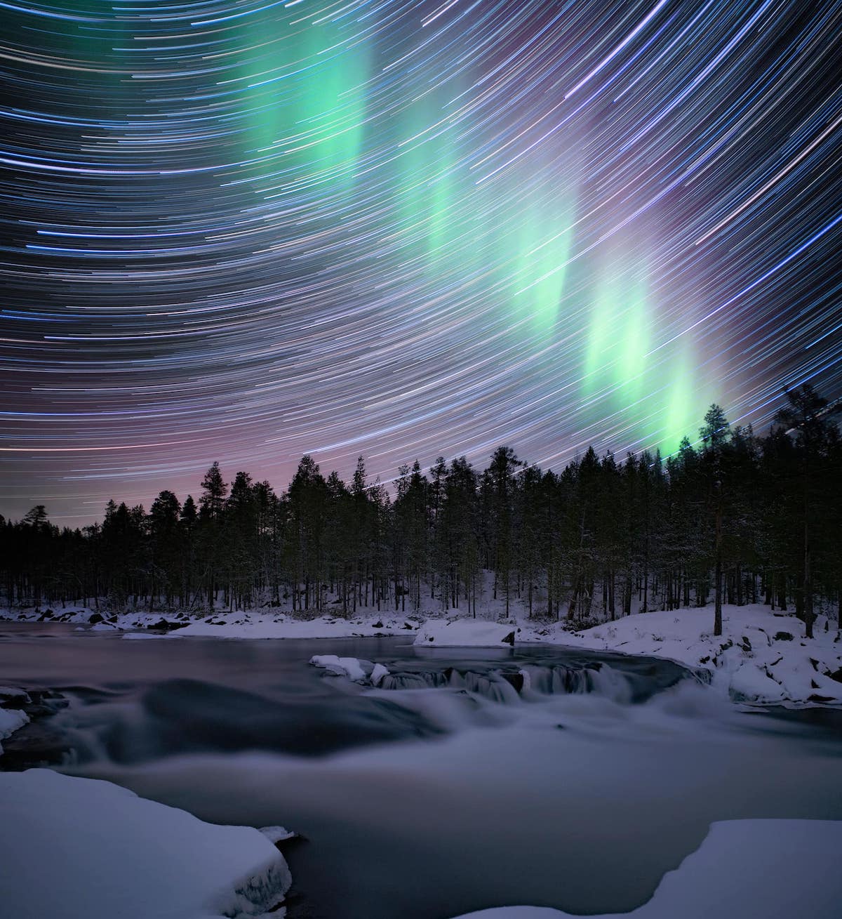 Waterfall Near Lapland Under the Northern Lights