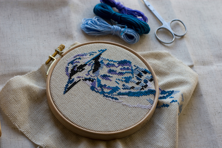 Cross Stitch of a Blue Bird in an Embroidery Hoop