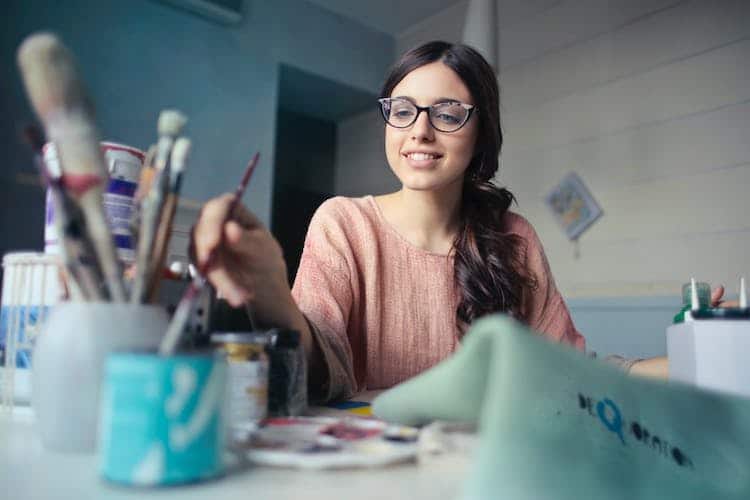 Woman Holding Paintbrush