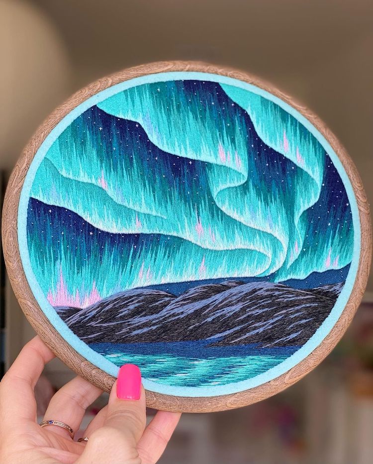 Hoop Art featuring the Northern Lights above the mountains